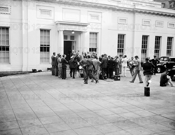 Film crew and photographers shooting group