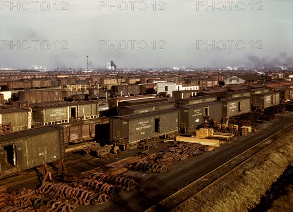 Freight cars being maneuvered in a Chicago and Northwestern [i.e. North Western] railroad yard