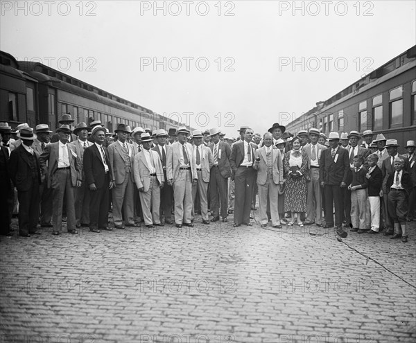 Group of men by train