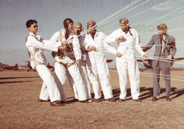 Instructor explaining the operation of the parachute to students