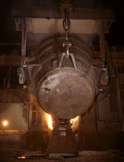 Ladle of molten iron is poured