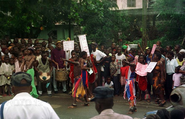 Liberian locals dance in the streets