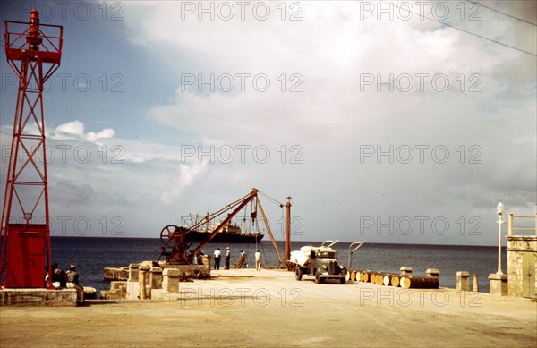 Loading cargo on a freighter in the harbor of Frederiksted