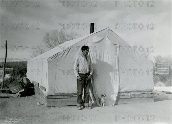 Man and Puppy in Front of Tent