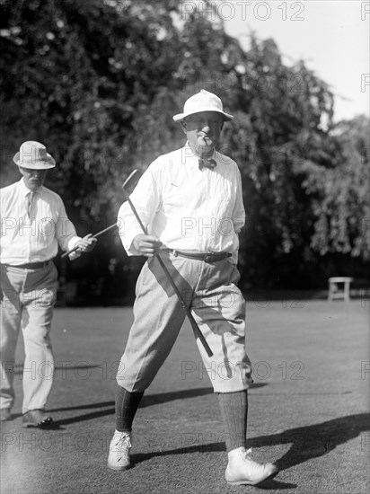 Man playing golf in 1914