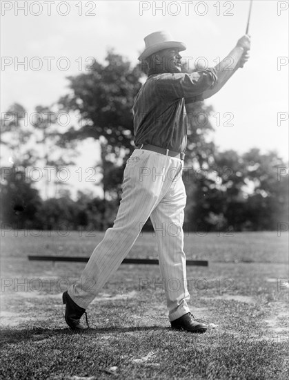 Man playing golf in 1914