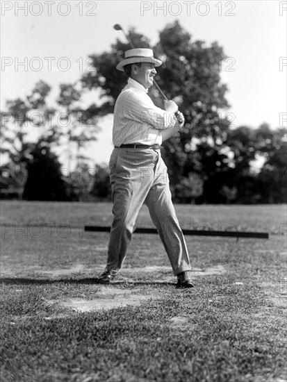 Man playing golf in 1914