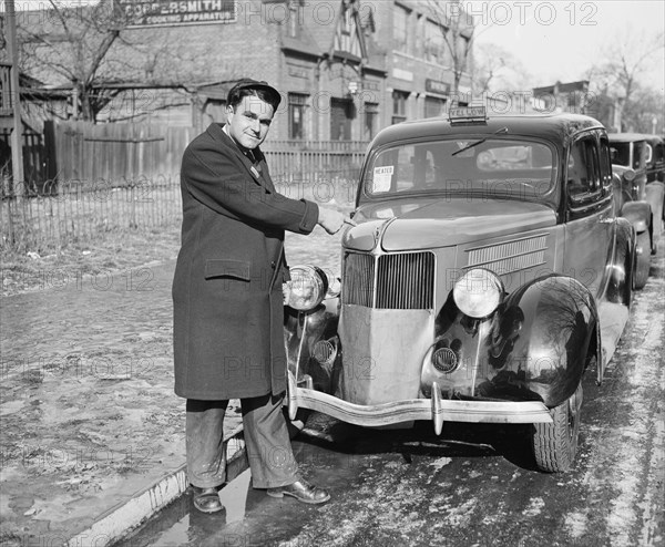 Man pointing at heated taxi cab from the Yellow Cab company