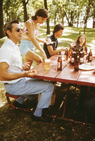 Man smoking a cigarette and drinking beer