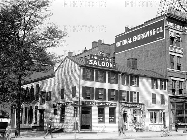 Man walking outside Mullany's Saloon