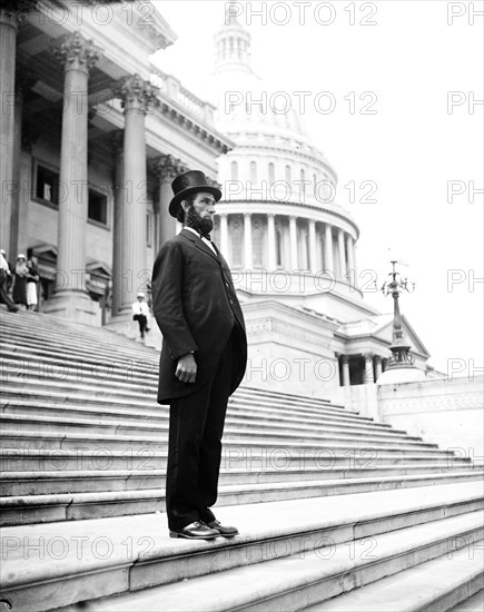 Person dressed as Abraham Lincoln on steps of U.S. Capitol