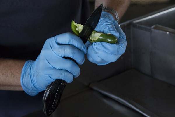 Agriculture Specialist inspects a shipment of peppers