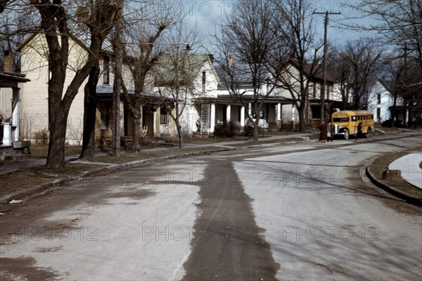 Small town school bus dropping off children near Portsmouth