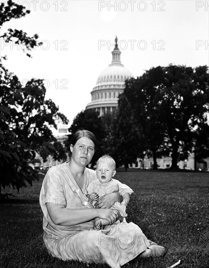 Woman and infant on lawn