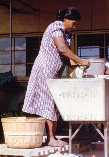 Woman at the community laundry on Saturday afternoon