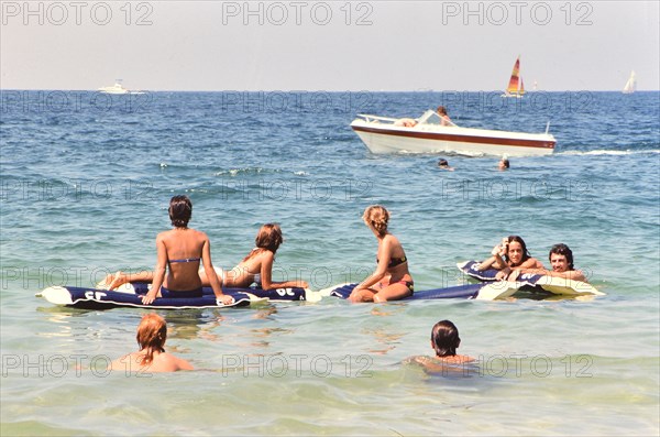 Young adults having fun in the water off the coast of Florida