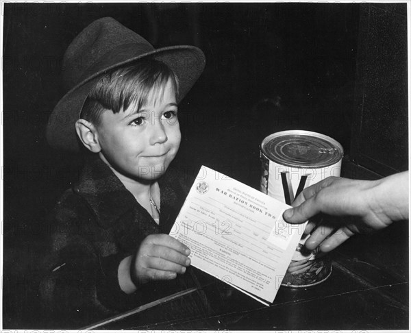 Young school boy uses War Ration Book