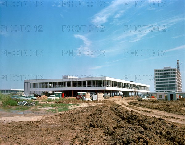 (25 Sept. 1963) This easterly view documents early construction of the Manned Spacecraft Center in September of 1963. The Avionics Systems Laboratory (Building 16) is in the foreground and the Project Management Building is see in the right background.