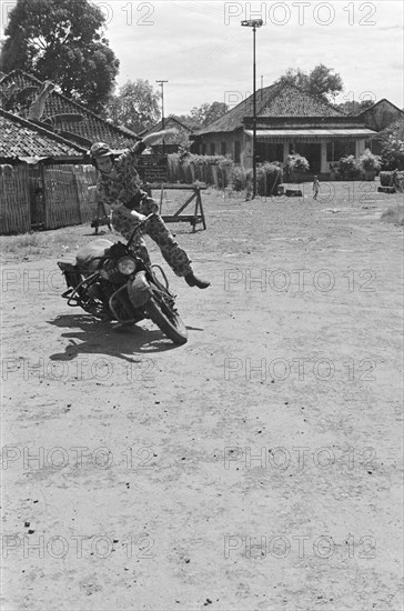 Demonstration skills motorcycle riding in Indonesia, Dutch East Indies ca. 1947