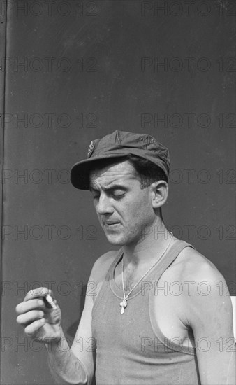 A soldier smokes a cigarette; Date November 1946 Location Batavia, Indonesia, Jakarta, Dutch East Indies