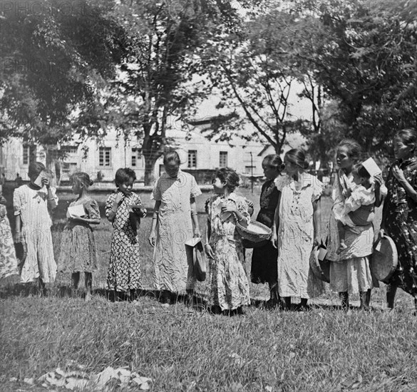 Indonesian Girls seem to have received new clothes; Date February 1947; Location Indonesia, Dutch East Indies