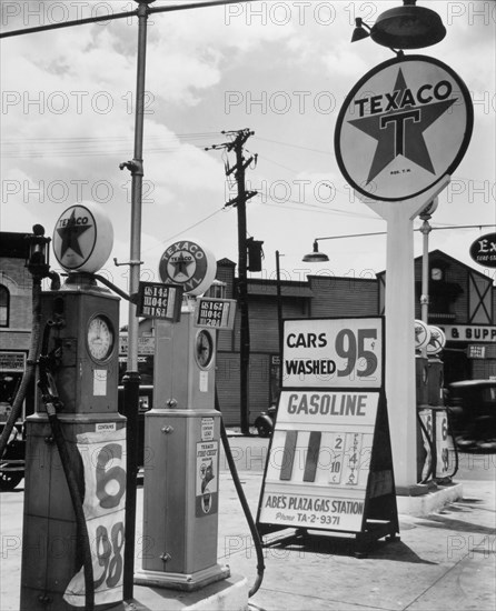 Texaco Gasoline station, Tremont Avenue and Dock Street, Bronx. Four gas pumps and tall Texaco sign at Abe's Plaza Gas station, with price for gas listed at 11 2/10 cents, cars washed for 95 cents.ca. 1936