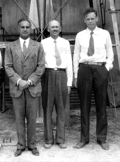 Standing in front of the rocket in the launch tower on September 23, 1935, are (left to right): Harry F. Guggenheim; Dr. Robert H. Goddard; and Col. Charles A. Lindbergh. Charles Lindbergh, an advocate for Goddard and his research, helped secure a grant from the Daniel and Florence Guggenheim Foundation in 1930.