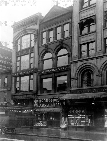 Exterior of People's Drug Store, 11th and G Streets, Washington, D.C., with other shops ca. 1909-1932