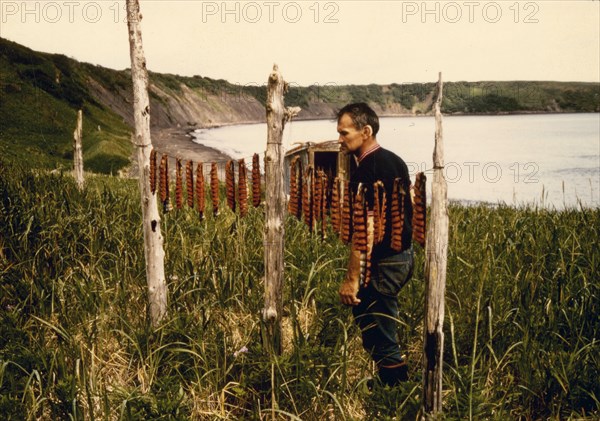 Native fisherman drying salmon at abandoned fish cannery 7 17 1973