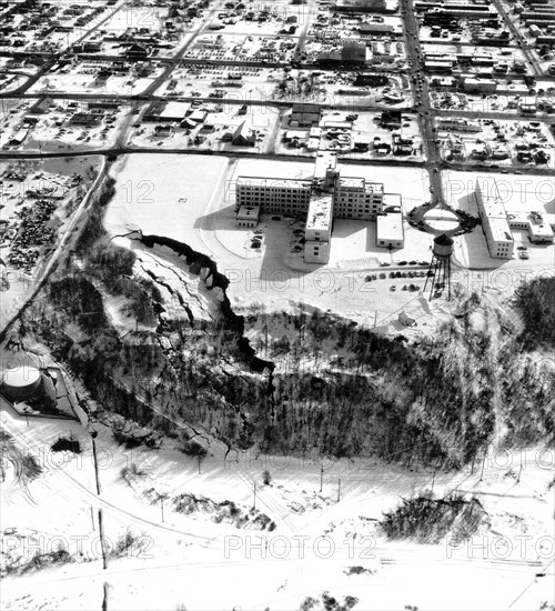 March 27, 1964 Alaska earthquake. The landslide occurred next to this hospital in Anchorage which is showing graben and pressure ridges.