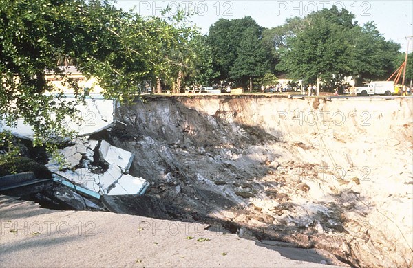 Winter Park Florida Sinkhole of 1981 - Remnants of community pool in sinkhole. View to east across the sinkhole.