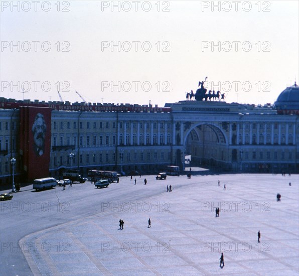 Pedestrians outside of a building (Ministries Buidling) on a cool spring day in St. Petersburg Russia in late 1970s (1978)