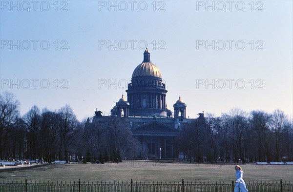 Woman walking outside a building in 1970s Russia (ca. 1978)