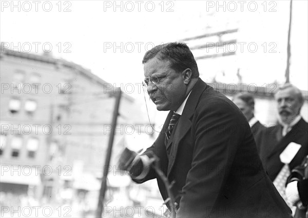 Theodore Roosevelt speaking, gesticulating with fist, outside, Yonkers, NY 1910