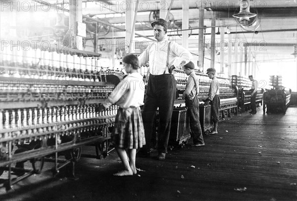 A young spinner in Yazoo City Yarn Mills. Said she was 13, but doubtful, May 1911