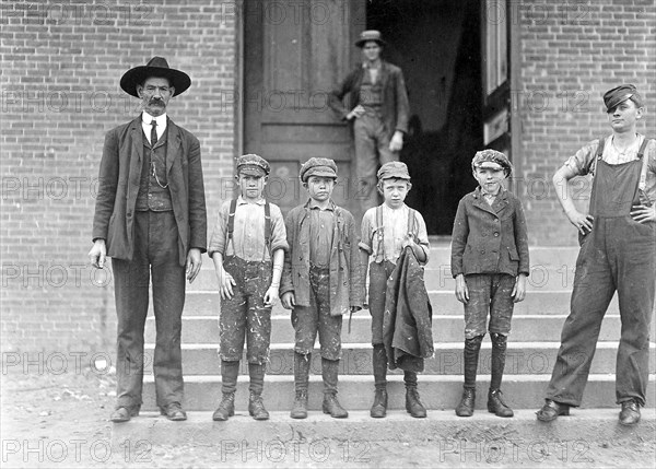 Boy with coat in hand is 11 years old. Been there 9 months, November 1908