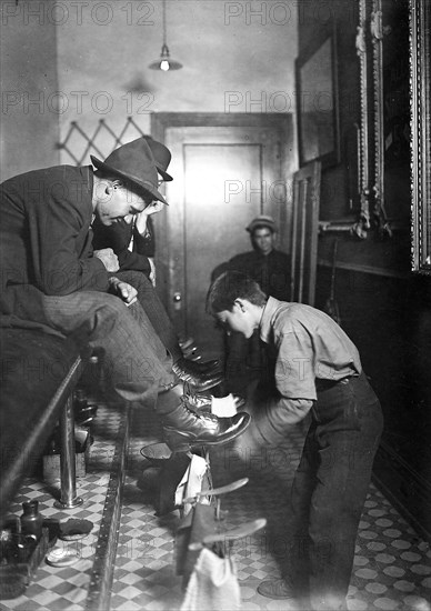 Greel's Shoe-Shining Parlor. Said he was 15 years old. Works some nights until 11 P.M. Indianapolis, Ind, August 1908