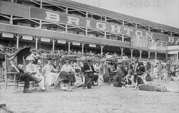 Men and women on Brighton Beach, Brighton Baths in the background ca. 1910-1915