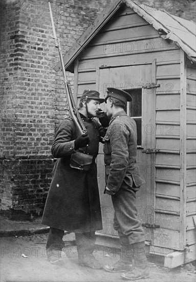 British and French soldier lighting a cigarette at Étaples, France during World War I ca. 1914-1915