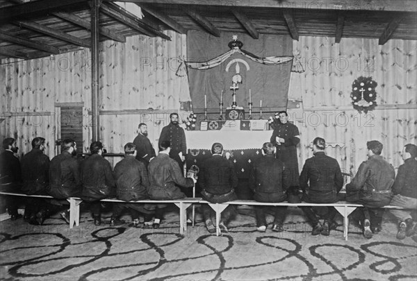 Russian prisoners seated in a chapel during services at Zossen prisoner of war camp, Wünsdorf, Zossen, Germany, during World War I ca. 1915