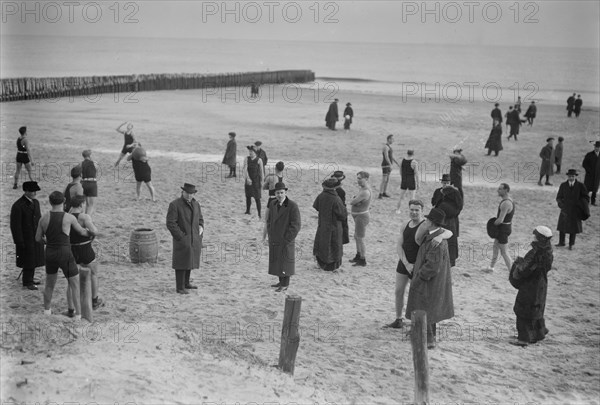 People on the beach at Coney Island on a cold day ca. January 1915