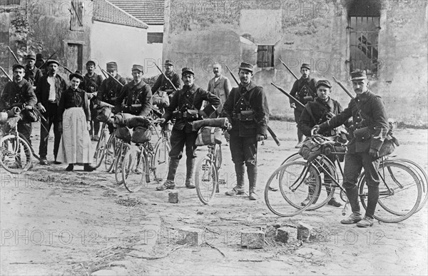 French soldiers on bicyles in Chauconin-Neufmontiers, France during World War I ca. 1914