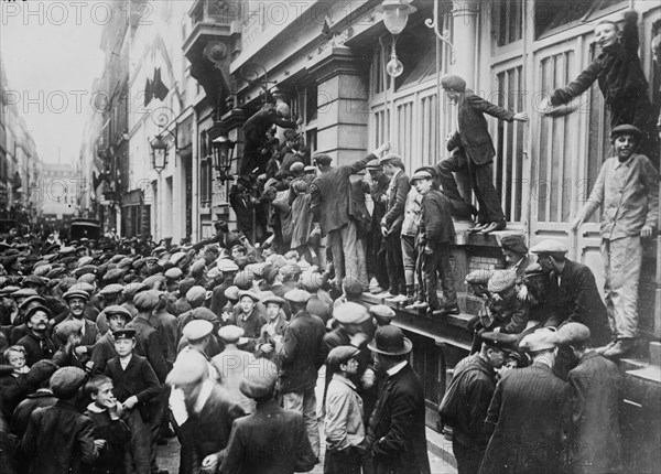 Newsboys waiting for news during the beginning of World War I, Paris, France ca. 1914-1915