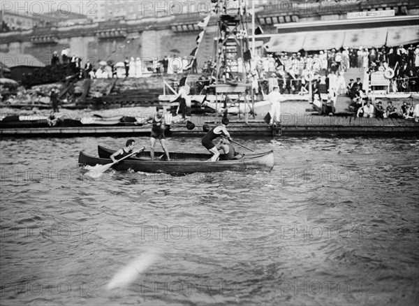 Men enjoying the summer fun of canoe tilting ca. 1910-1915