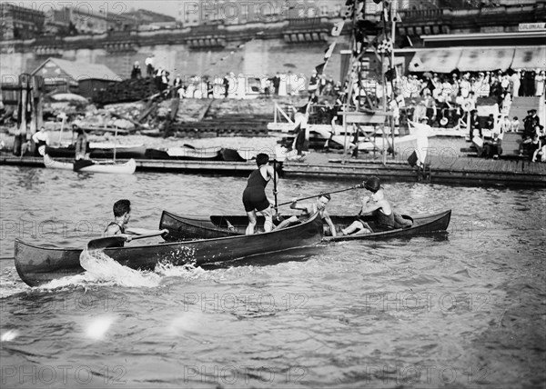 Men enjoying the summer fun of canoe tilting ca. 1910-1915