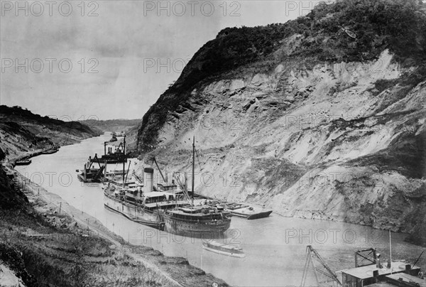 A ship passing through Culebra Cut -- Panama Canal ca. 1910-1915