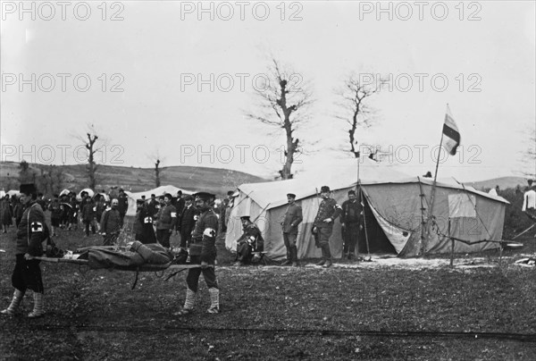 Medical personnel (probably Bulgarians) carrying man on stretcher at Çatalca, Turkey during the Balkan Wars ca. 1912-1913