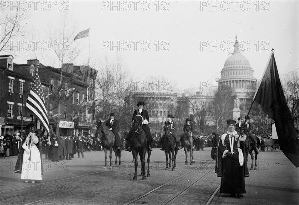 Grand Marshal Mrs. Richard Coke Burleson (center, on horseback) leading suffrage march on March 3, 1913
