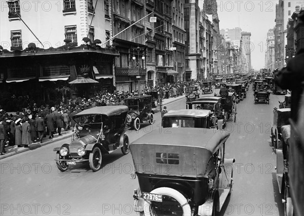 Cars driving down Fifth Avenue in New York City on Easter Sunday 1913