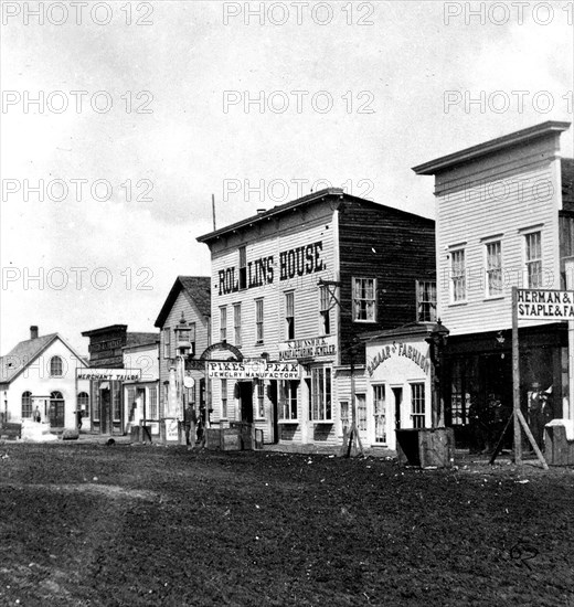 This is a stereoscopic view of Main St in Cheyenne (Laramie County), Wyoming in 1869.